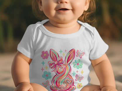 Baby in white onesie with colorful bunny and butterfly print.