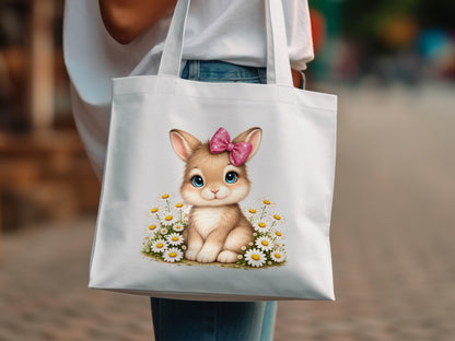 White tote bag with a cartoon bunny wearing a pink bow and surrounded by daisies.