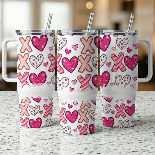 Three white travel mugs with pink XOXO and heart pattern, standing side-by-side.