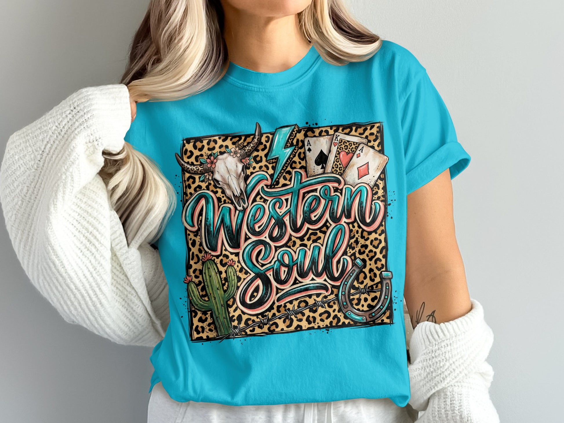 Western Soul graphic tee with skull, cactus, horseshoe, and playing cards.
