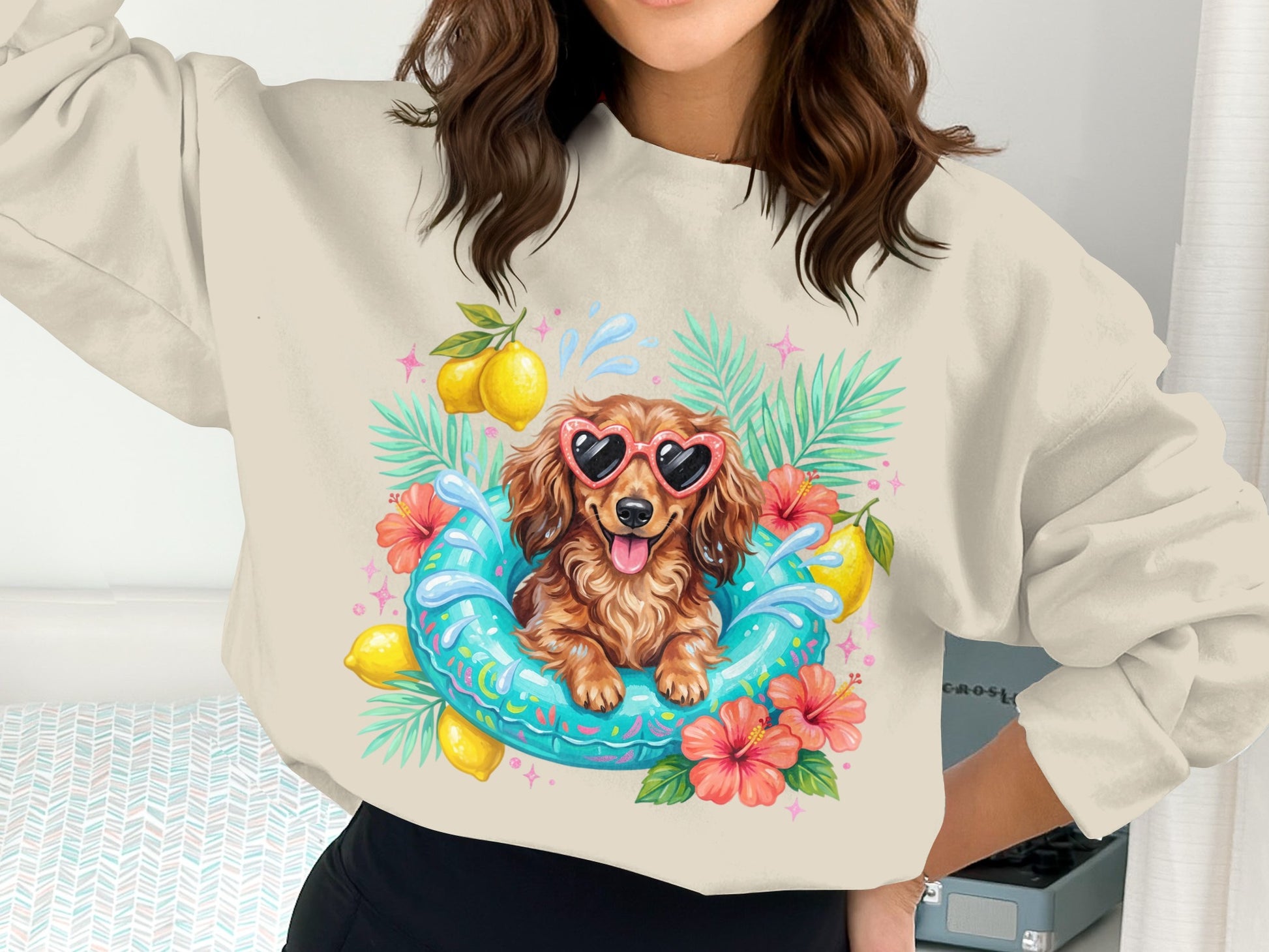 Dachshund wearing heart sunglasses in a pool float surrounded by tropical leaves and flowers.