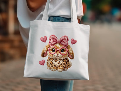 White tote bag with cute leopard print bunny wearing pink glasses and a bow.