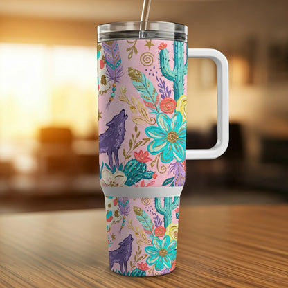 Pink tumbler with wolf and floral designs, featuring a handle and straw.