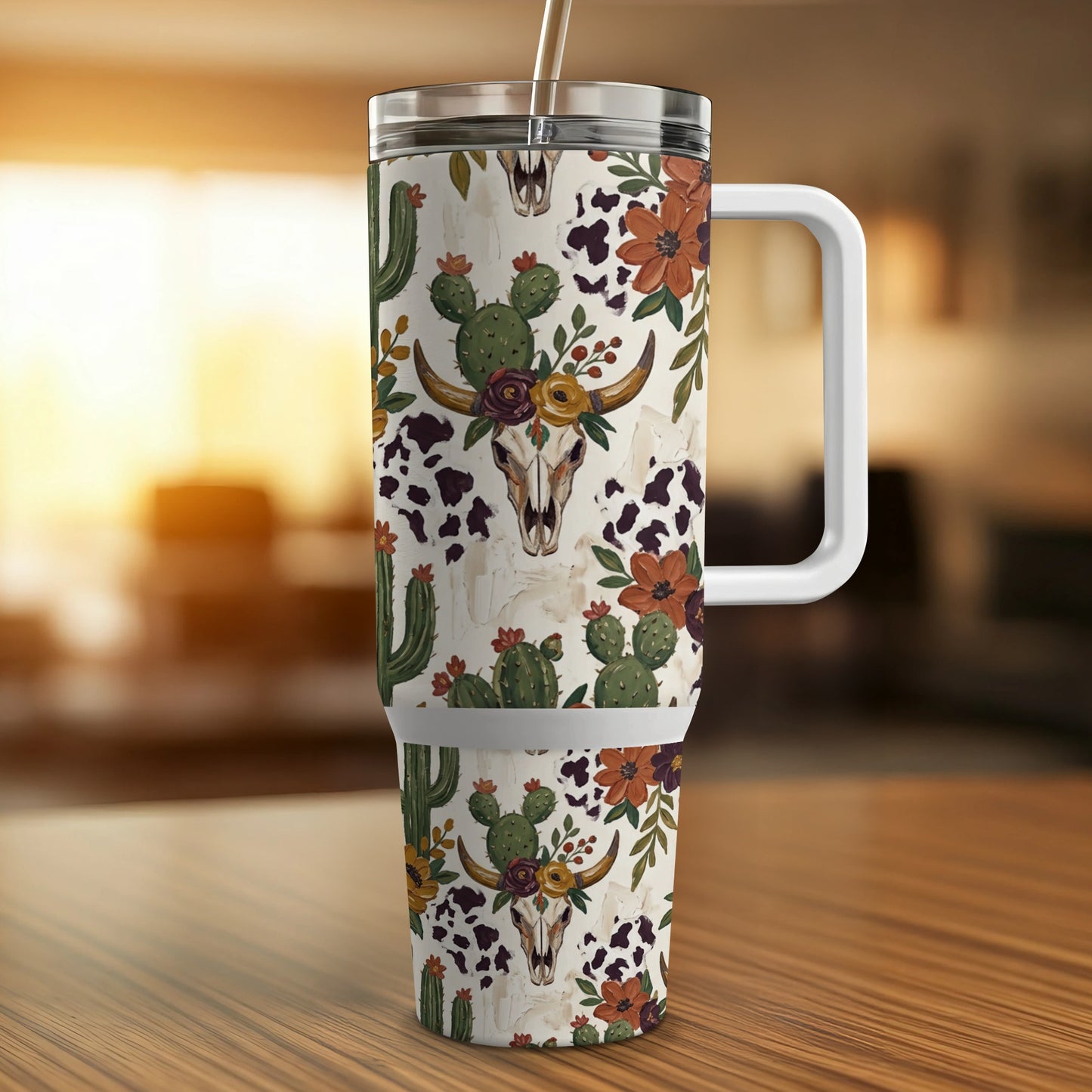 Western-themed tumbler with cow skull, cactus, and floral pattern.