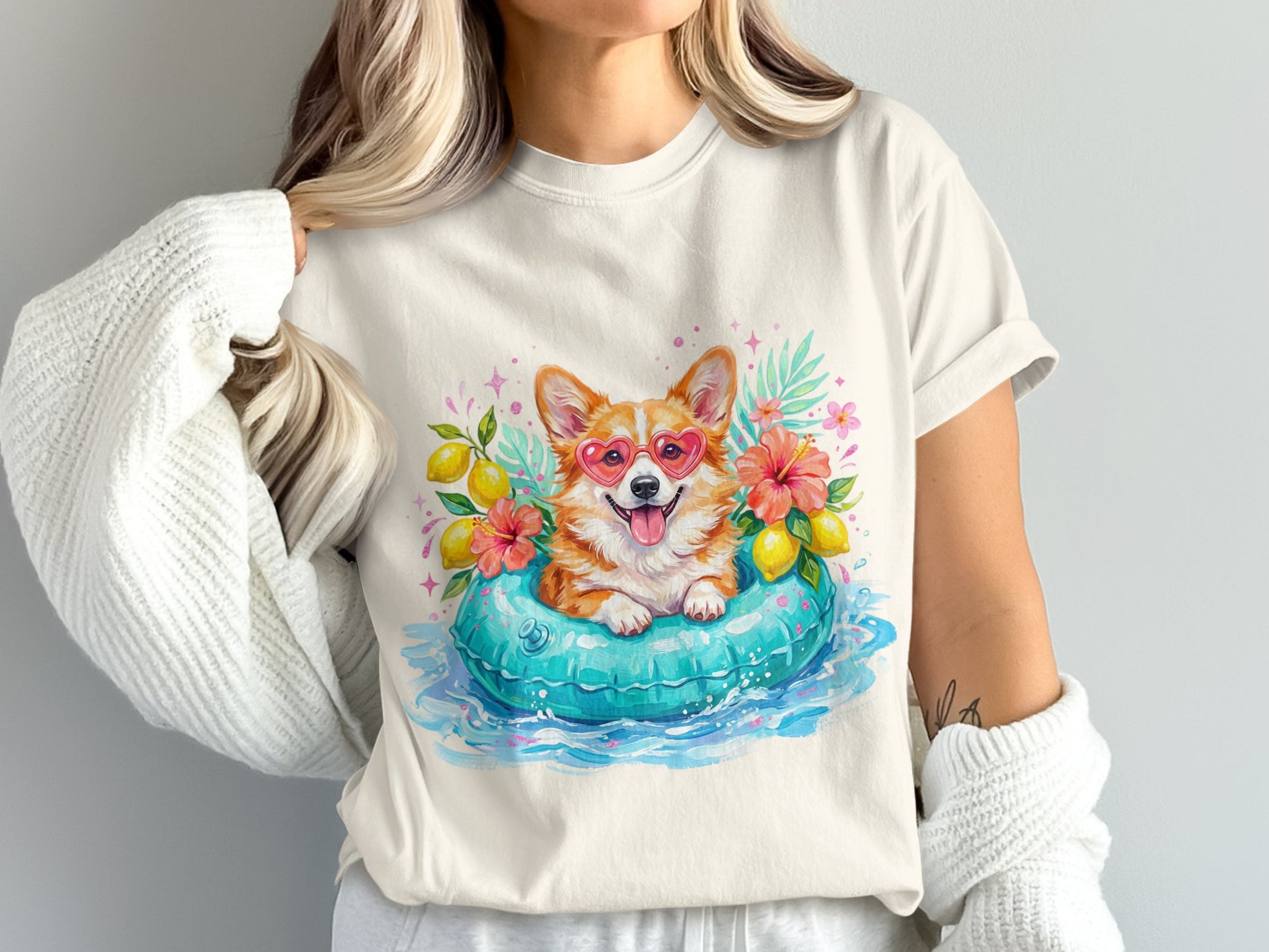 Corgi in heart sunglasses floats in a pool with lemons and flowers.