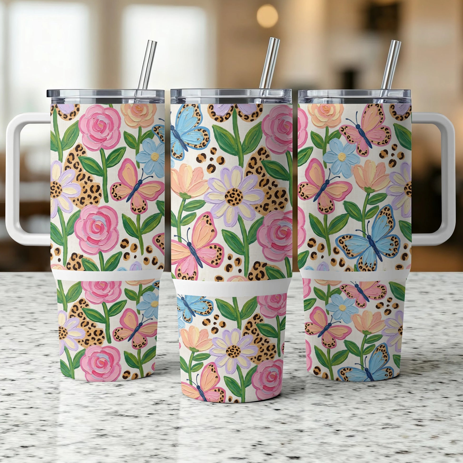 Three tumblers with floral and butterfly pattern, and leopard print.