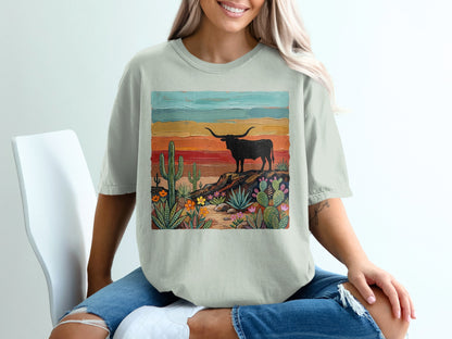 T-shirt with a painted desert landscape featuring a longhorn bull.