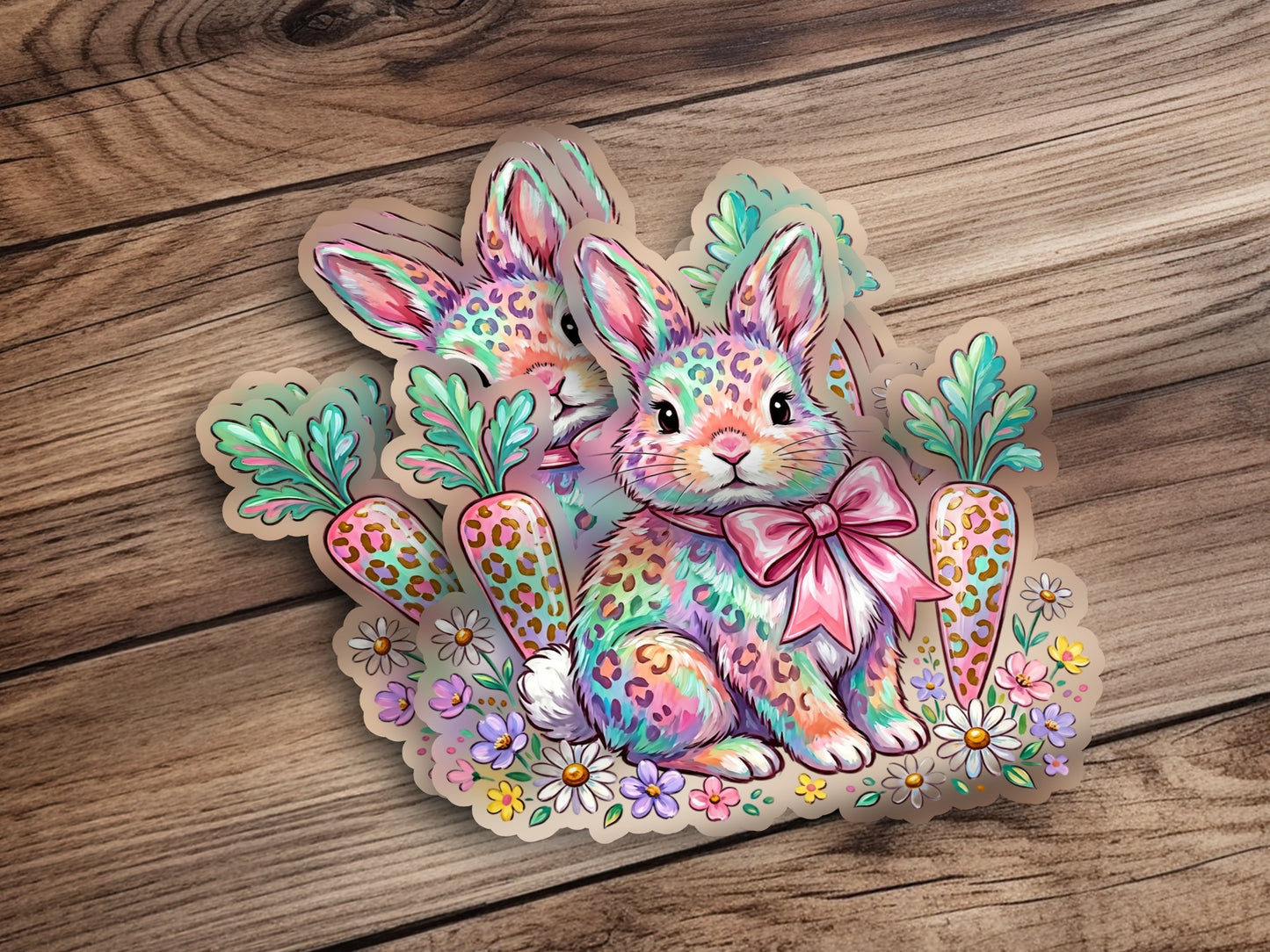 Two colorful leopard-print bunnies with carrots and flowers.