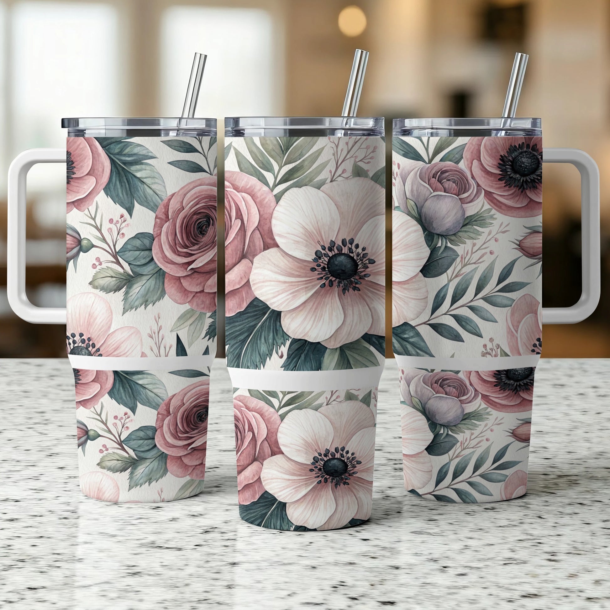 Three floral tumblers with handles and straws, featuring pink roses and anemones.
