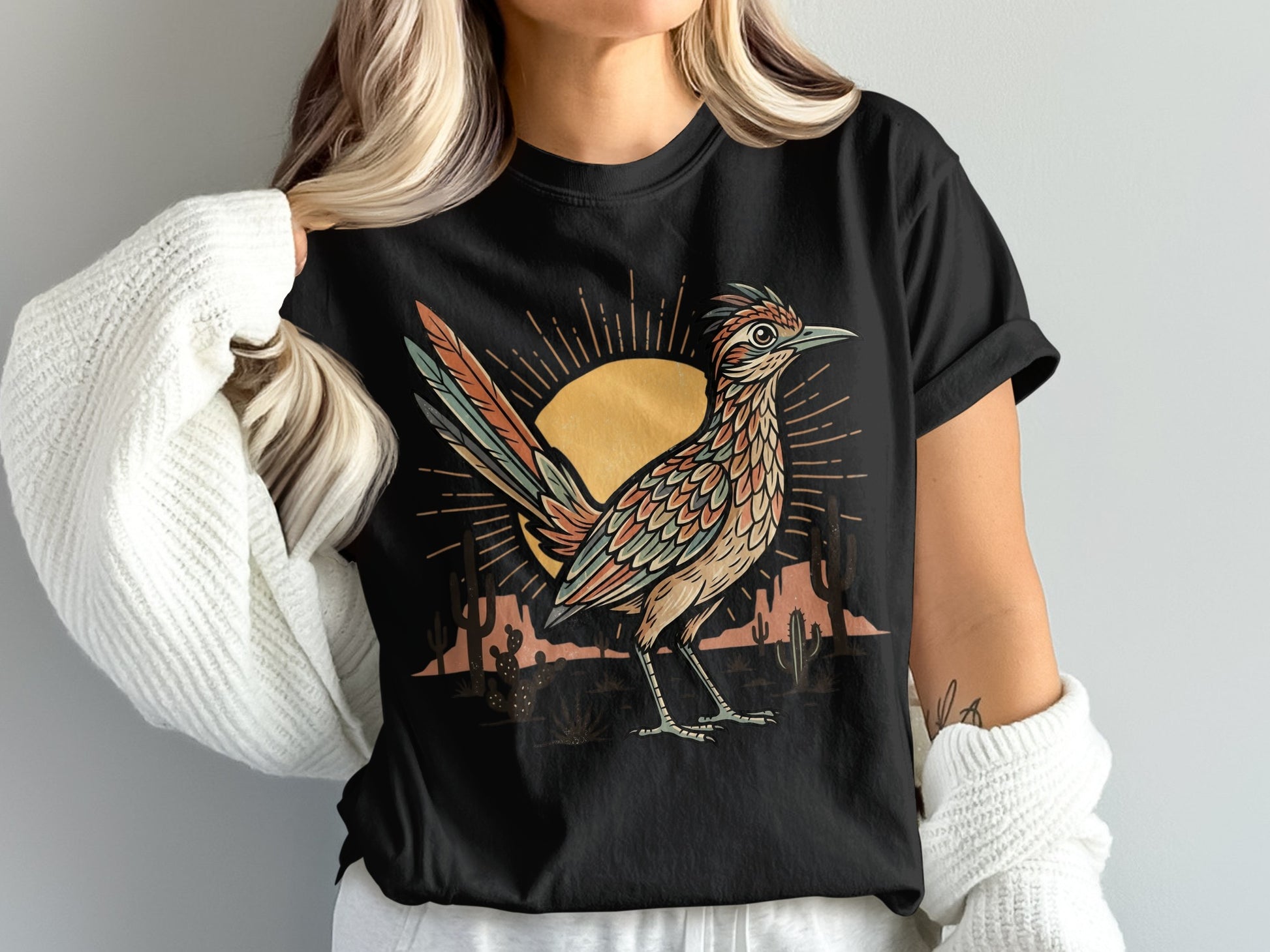 Roadrunner graphic on a black t-shirt with a desert sunset and cacti.