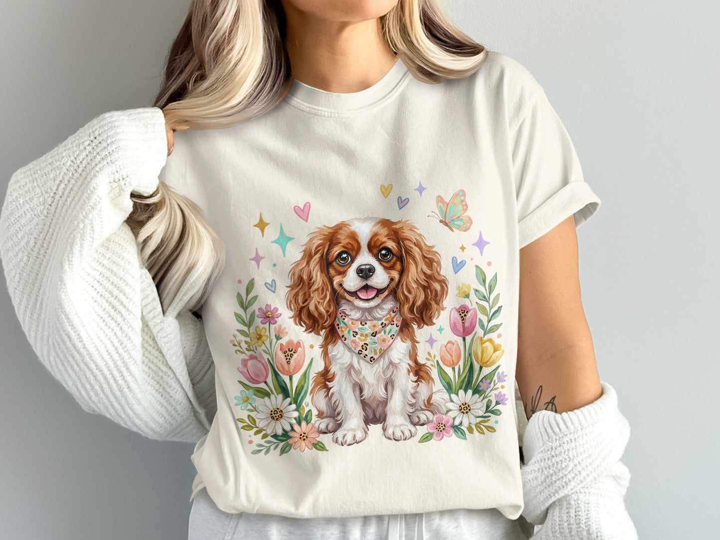 Cavalier King Charles Spaniel with floral border and colorful hearts.