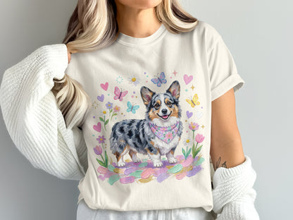 Corgi with watercolor floral and butterfly accents on cream t-shirt.