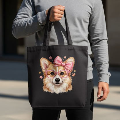 Black tote bag with a cartoon corgi wearing glasses and a pink bow.
