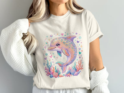Cream t-shirt with a playful, colorful dolphin and coral reef illustration.