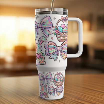 White tumbler with Easter bunny and egg designs, handle, and straw.