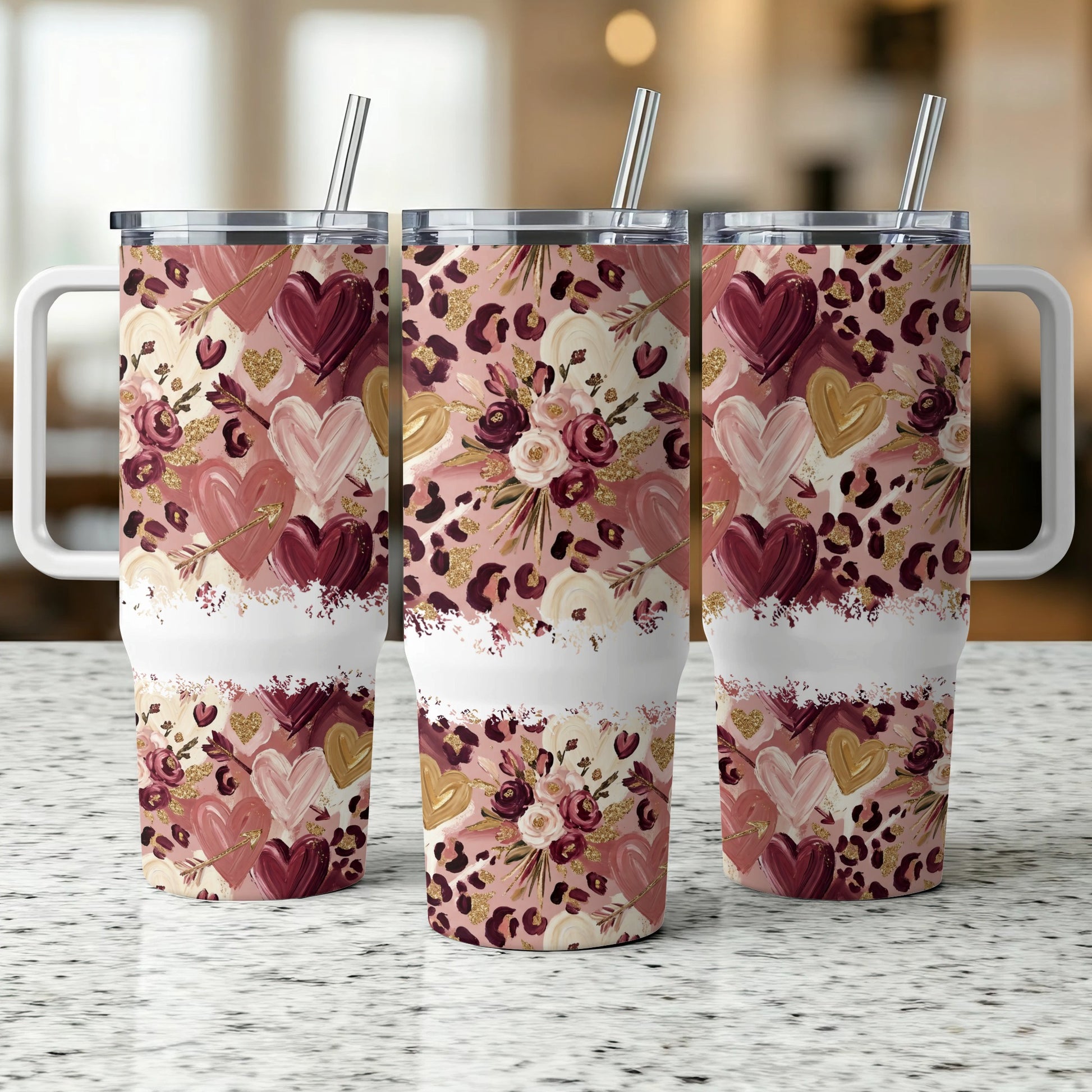 Three Valentine's Day themed tumblers with hearts, flowers, and leopard print.