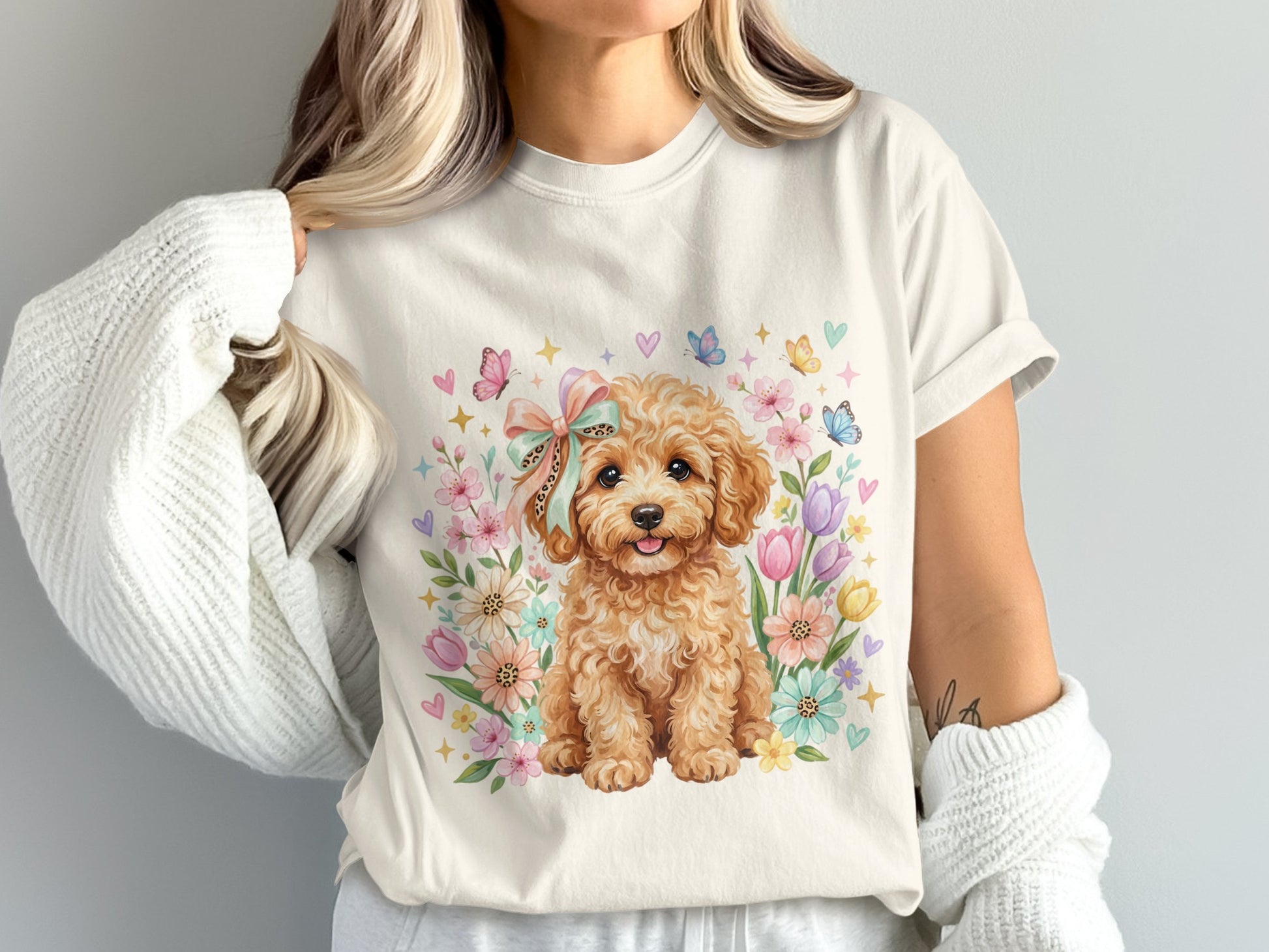 Fluffy dog wearing a bow surrounded by flowers and butterflies.