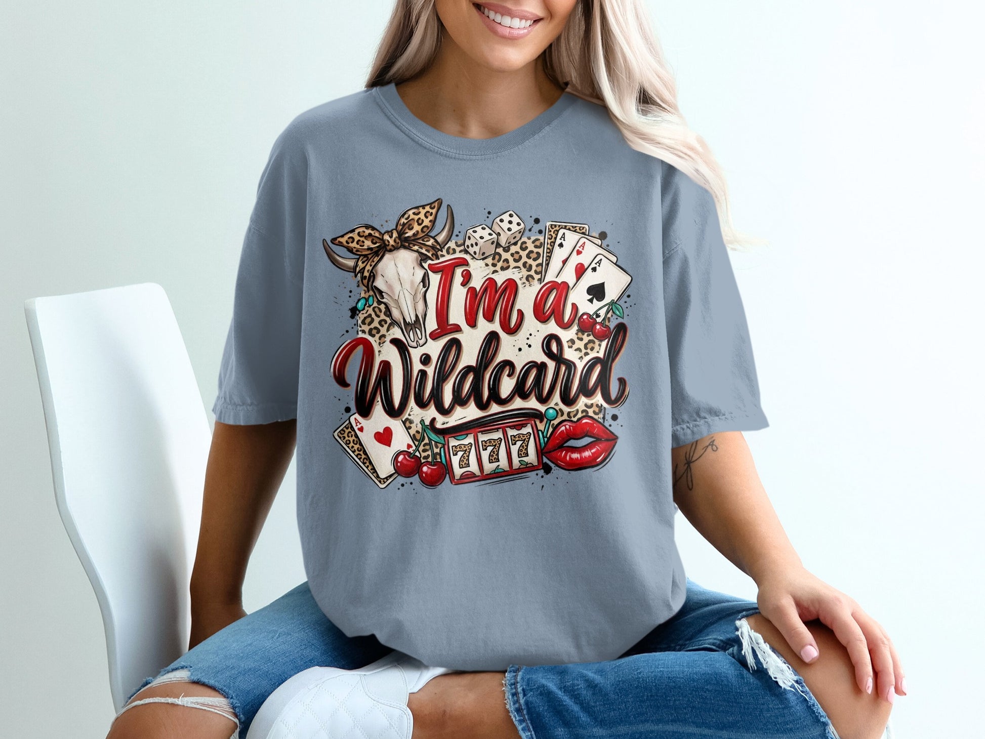 T-shirt with "I'm a Wildcard" text, skull, dice, cherries, slot machine, and lips.